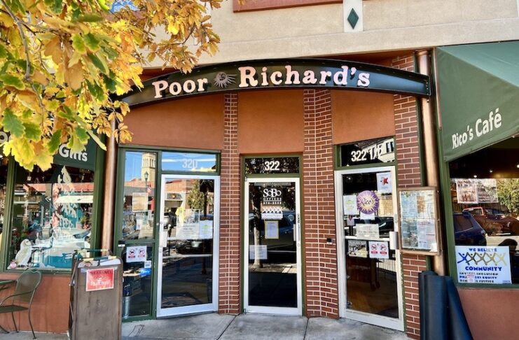 Three doorways to Poor Richard's Downtown book and gift store, Rico's Cafe and Little Richard's Toy Store in Colorado Springs.