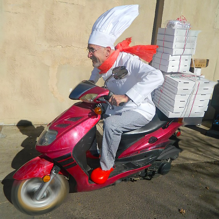 Richard Skorman delivers pizzas on a moped from his Poor Richard's Restaurant.