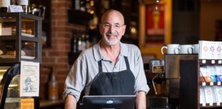 Owner Richard Skorman behind the counter at Rico's Cafe, part of the Poor Richard's Downtown complex of small businesses.