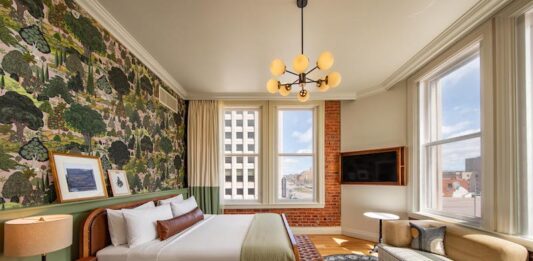 6 Reasons We Love the Mining Exchange Hotel A corner king room with historic brick wall, hardwood floors and stylish finishes, all amenities that make the Mining Exchange Hotel one of the best hotels in Colorado Springs.