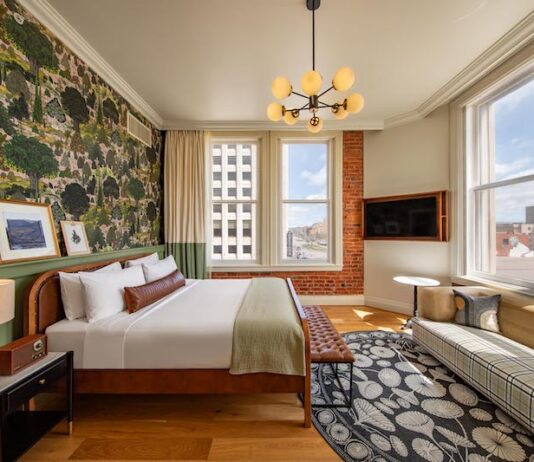 6 Reasons We Love the Mining Exchange Hotel A corner king room with historic brick wall, hardwood floors and stylish finishes, all amenities that make the Mining Exchange Hotel one of the best hotels in Colorado Springs.