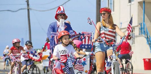 Where to Find Fourth of July Fun — Even Without the Fireworks Kids ride bikes in the Monument July 4 Parade.