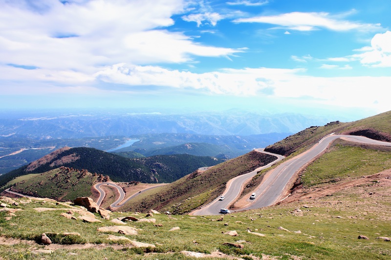 Blue skies, green mountainsides and the twists and turns of the Pikes Peak Highway.