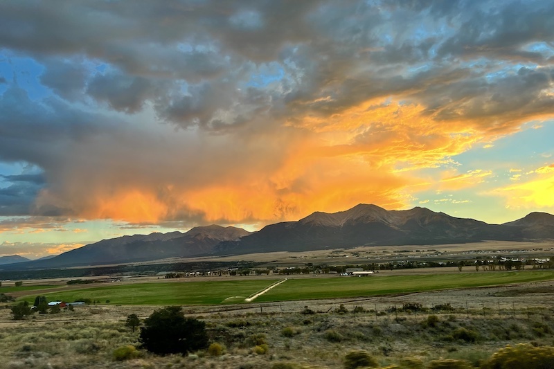 A red sunset glows in the clouds above Mount Princeton outside of Buena Vista, Colorado