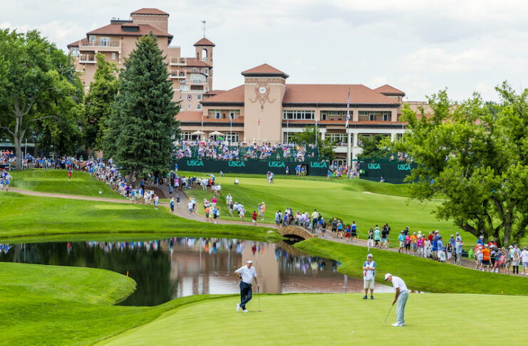 A player putts on the pristine green in front of The Broadmoor hotel at the US Senior Open