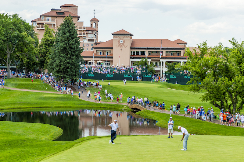A player putts on the pristine green in front of The Broadmoor hotel at the US Senior Open