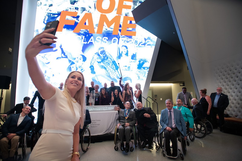 Lindsey Vonn takes a selfie with the Olympic and Paralympic Class of 2022 at the Olympic Museum. 