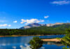 Blue skies over Catamount Reservoir with Pikes Peak above. The view is one of the reasons this is one of the best lakes in Colorado Springs.