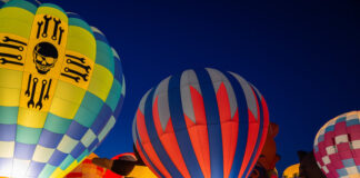 Hot air balloons glow at Labor Day Lift Off, the biggest hot air balloon festival in Colorado Springs.