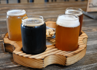 Gunslinger Brewing Four beers set in wooden tray on table