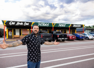 Inked and Infused Owner Rocky Ross stands in front of Inked and Infused in Colorado Springs.