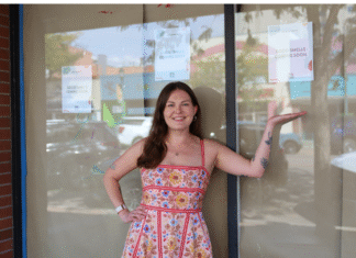 Good Intentions Good Intentions owner, Kelsee Swen, stands in front of her new store exterior windows.