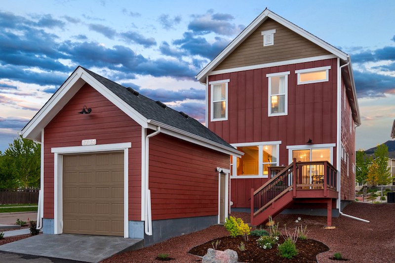 The detached garage and back patio of the Derby Cottage model home by Vanguard Homes at Gold Hill Mesa.