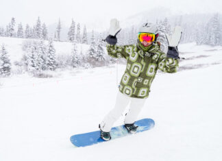 All the Colorado Ski Resort Opening Dates 2026-2027 A snowboarder celebrates at Opening Day of Arapahoe Basin. Will A Basin be the first Colorado ski resort to open for the season?