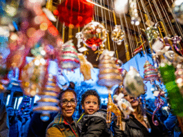 A New Holiday Tradition: Old Colorado City Christkindlmarket Invites Colorado Springs to Celebrate the Season Woman and child enjoy festive holiday decorations during Christkindl Market.