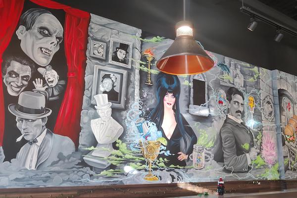 Mural of famous people from Colorado Springs at Cheba Hut Interquest