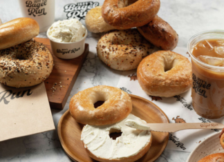 Jeff’s Bagel Run Assorted bagels, cream cheese and coffee laid out for promotional image