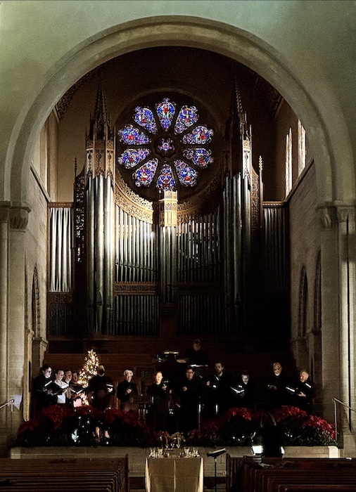 Stained glass glows and candles flicker in Shove Chapel at Colorado College for the annual Wintersong concert