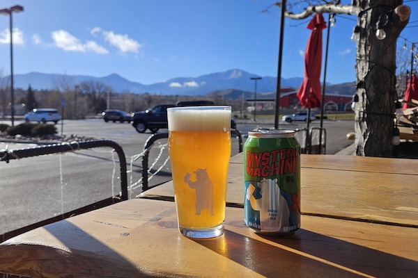 Beers on the patio at 105 West Brewing at Garden of the Gods, with view of Pikes Peak.
