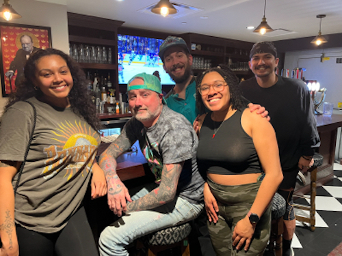 A group of friends at The Brit Pub on Trivia Night in Colorado Springs
