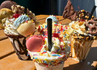 Lolley’s Ice Cream to Open Downtown Ice cream shakes topped with sprinkles, macaroons and other sweet treats placed on outdoor table at Lolley's Ice Cream