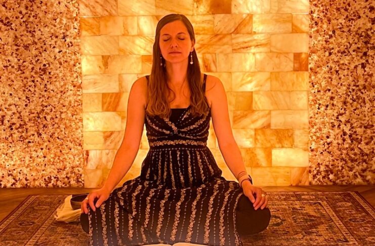 A woman meditates during halotherapy at the Colorado Salt Cave Wellness Center, which is part of the Visit Colorado Springs Wellness Pass.