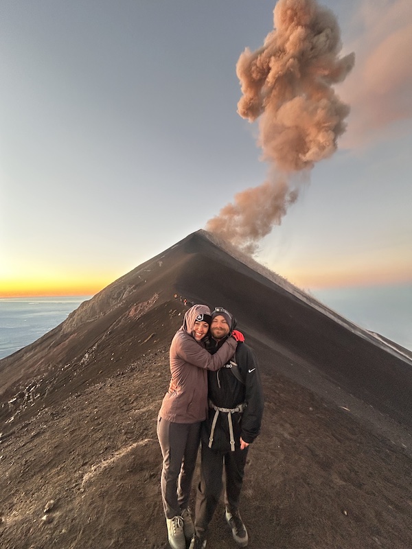 Leslie and Bryce McCright hike near Fuego de Volcan in Guatemala on a mountain bike adventure trip with Endure Adventures.