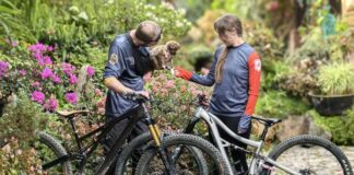 A author and her husband with bikes and a puppy on a mountain biking adventure trip with Endure Adventures.