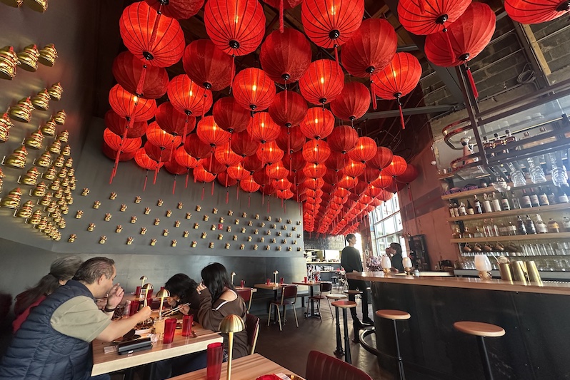 The interior at Night Ramen strung with red Asian lanterns.