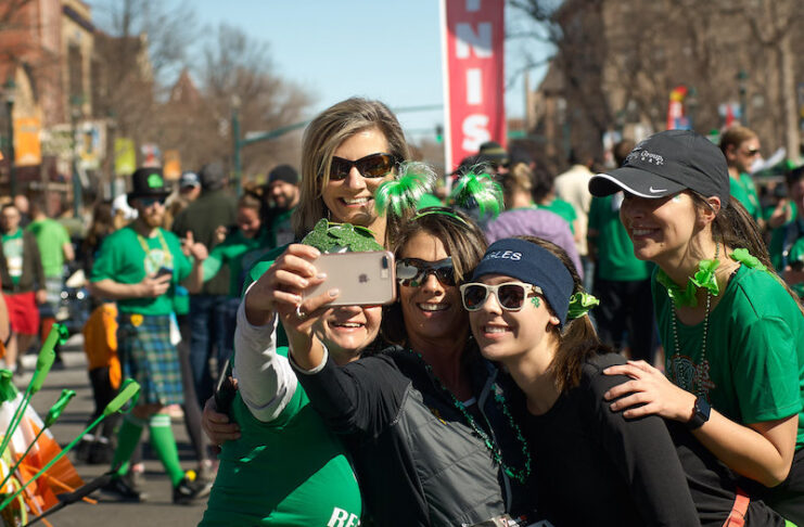 Women take a selfie at the St. Patrick's Day Parade in Colorado Springs.