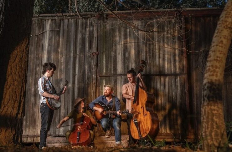 Portrait of the and Sturtz playing outside a barn.