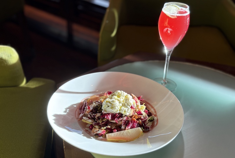 Radicchio salad and a cocktail at The Broadmoor Summit restaurant, one of the best restaurants in Colorado Springs.