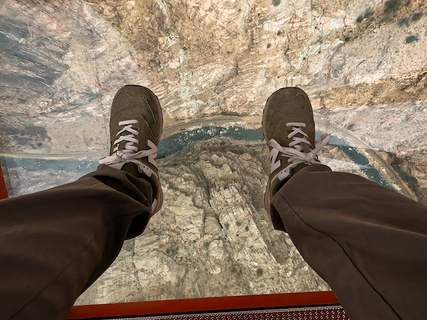 A view through the clear floor of the Royal Gorge Gondola at the Arkansas River in the bottom of the Royal Gorge.