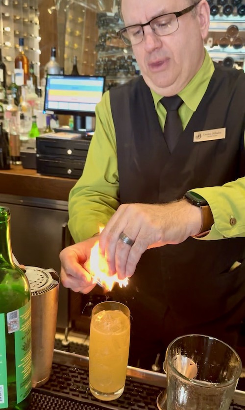 Bartender Dennis Schuler creates a Smoking Margarita cocktail at the Broadmoor's Summit.