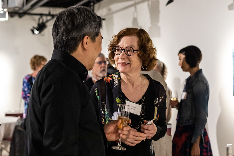 Associate director of the Colorado College Summer Music Festival chats at a reception.