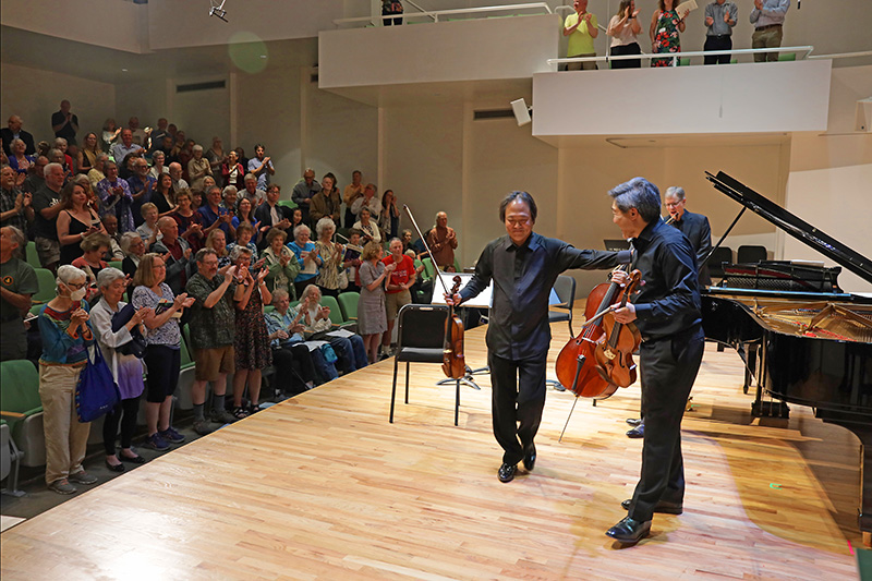 Colorado College Summer Music Festival artists Scott Yoo, violin; Phillip Ying, viola; and John Novacek, piano, on stage.