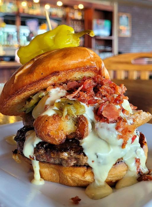 A towering burger special at the Public House, a People's Choice Top 3 for best burgers in the People's Choice awards.