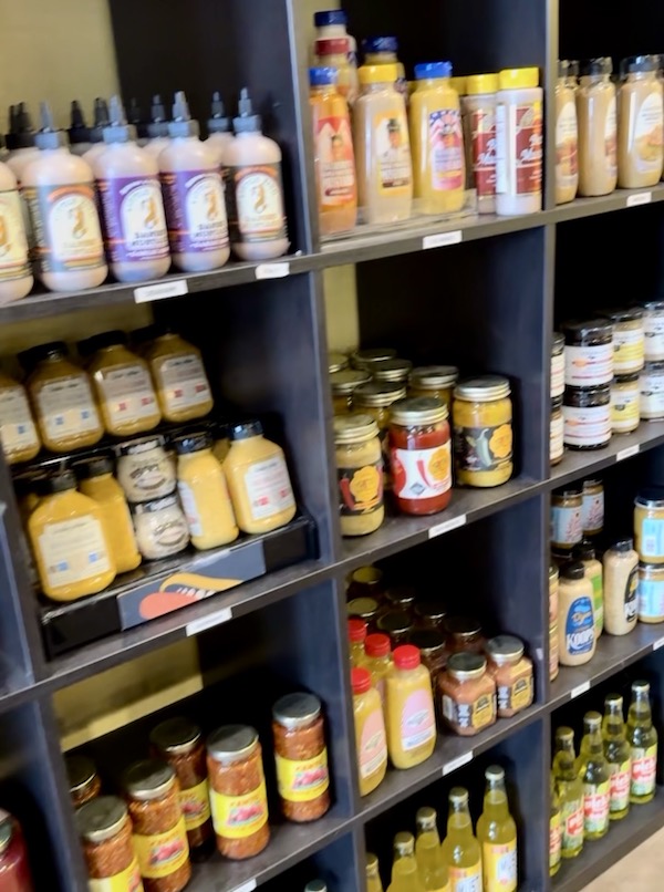 Shelves full of mustard at Colonel Mustard's.