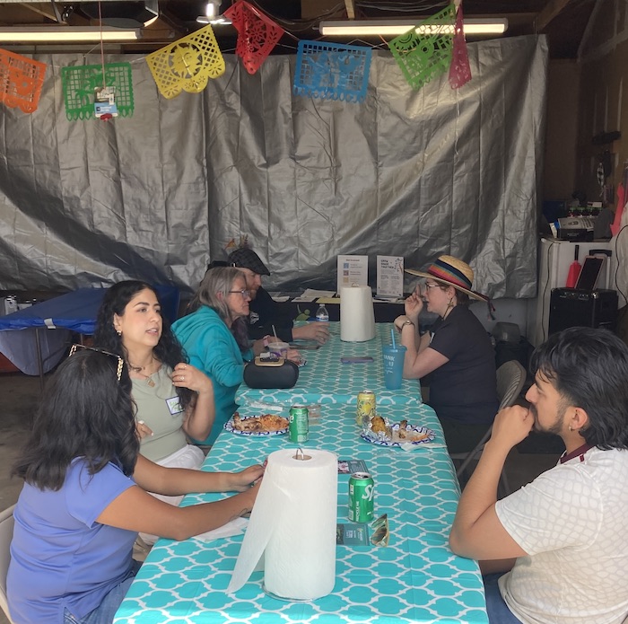 Neighbors in the Mid Shooks Run Park in Colorado Springs gather for a 150 Tables taco party celebrating the summer solstice on June 21, 2026.