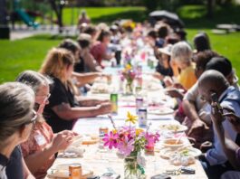 150 Tables Builds Vibrant Communities, One Neighbor at a Time A long table in the park for a 150 Tables gathering by Hey Neighbor in Colorado Springs