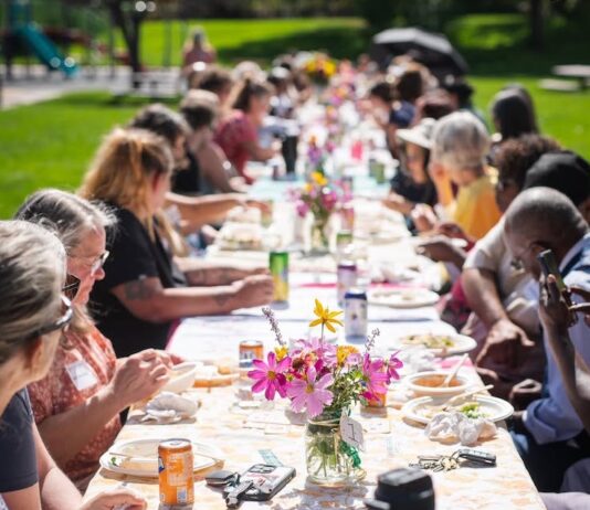 150 Tables Builds Vibrant Communities, One Neighbor at a Time A long table in the park for a 150 Tables gathering by Hey Neighbor in Colorado Springs