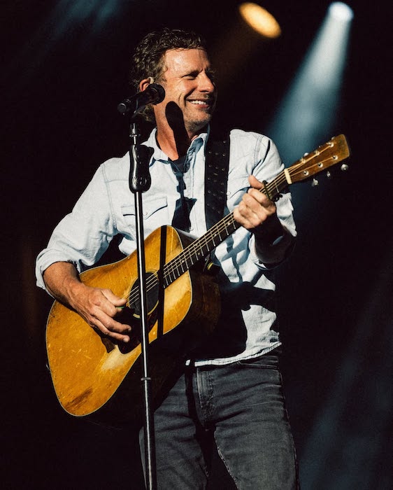 Dierks Bentley plays guitar live on stage