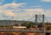 An athlete highlining over the Royal Gorge Bridge.