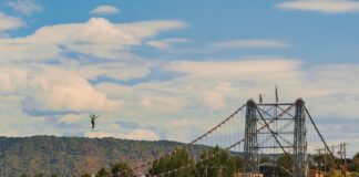 An athlete highlining over the Royal Gorge Bridge.