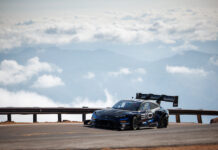 Your Insider Guide to the Pikes Peak Hill Climb Romain Dumas on the course above the clouds in the 2025 Pikes Peak International Hill Climb.