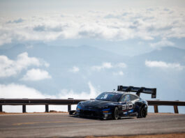 Your Insider Guide to the Pikes Peak Hill Climb Romain Dumas on the course above the clouds in the 2025 Pikes Peak International Hill Climb.