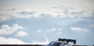 Your Insider Guide to the Pikes Peak Hill Climb Romain Dumas on the course above the clouds in the 2025 Pikes Peak International Hill Climb.