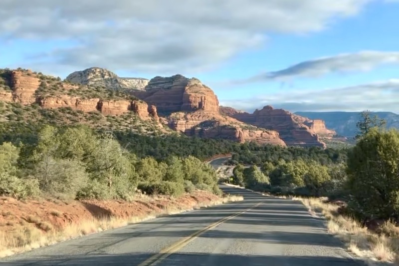 Red rock mountains on the horizon on the road to Sedona