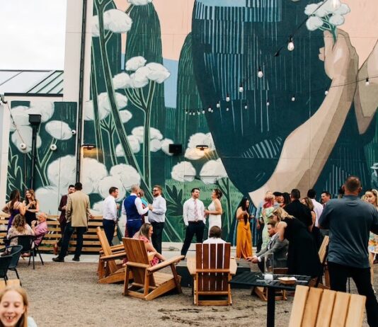 Kinship Landing Celebrates Five Years of Community Near and Far A wedding reception in The Yard at Kinship Landing boutique hotel in Colorado Springs.