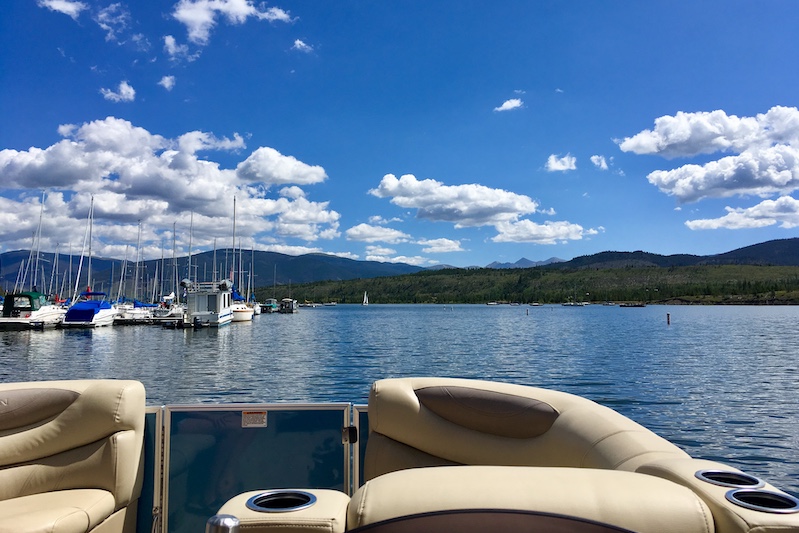 View from behind the wheel of a pontoon boat rental on Lake Dillon heading out of Frisco Marina.
